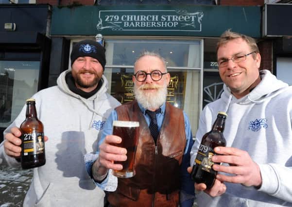 Barber Michael Sowerby has become the face of a new beer by local brewers Trawlboat Brewery.  He is pictured with Jon Worswick and Jared Salisbury from the brewery.