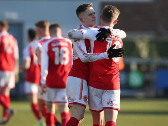 Ash Hunter hugs Conor McAleny after netting his seventh of the campaign
