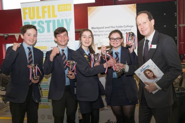 The finals of the Young Engineers competition at Blackpool and the Fylde College. Winners St Bede's receive their prize from Matt Lambert of Cuadrilla.