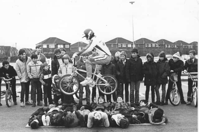 A dozen BMX fanatics were given first-hand experience of the amazing tricks that can be peformed on these built-for-speed push bikes.
Seen in mid-flight is British champion Andy Ruffell who took part in the demonstration at the Co-op Blackpool Hypermarket, Marton, along with European title holder Wayne Llewellyn, in December 1983