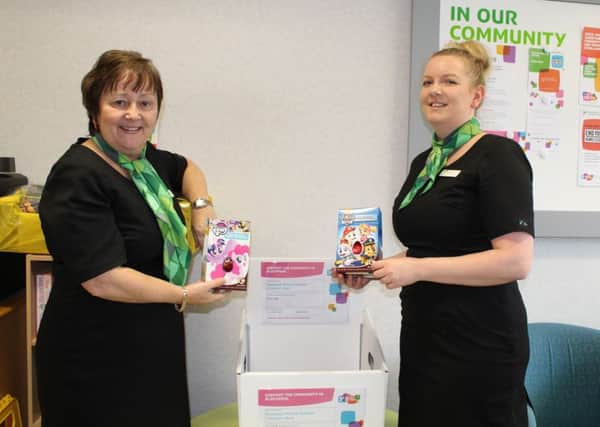 Clair Greenwood and Sue Vinden with some of the Easter
eggs donated to Yorkshire Building Society on Birley Street, Blackpool,
for children at Blackpool Victoria Hospital.