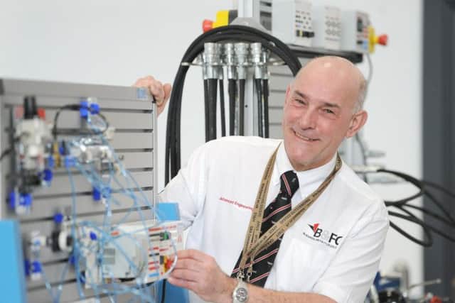 The Lancashire Energy HQ's Gavin Tyrrell demonstrating pneumatics systems used for training