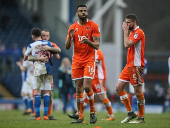 A dejected looking Curtis Tilt applauds the Blackpool fans at the final whistle