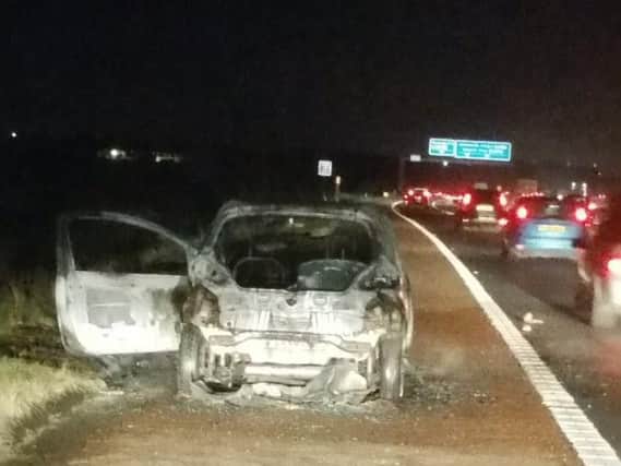 A car fire on the M55 meant police closed the road while the blaze was put out.