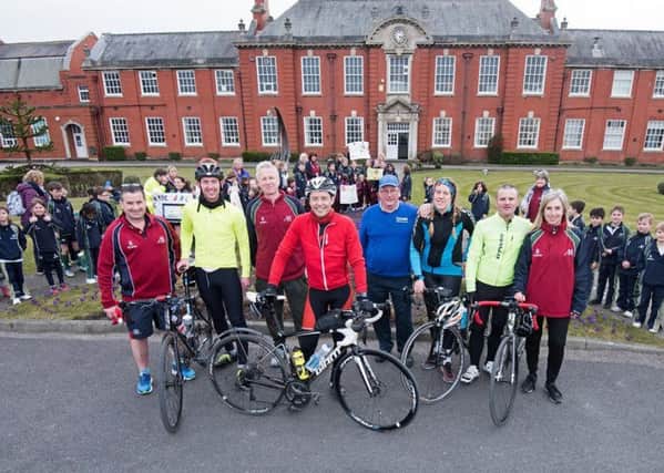 AKS pupils greeted two cyclists on a marathon trek and also helped to raise cash for Sport Relief