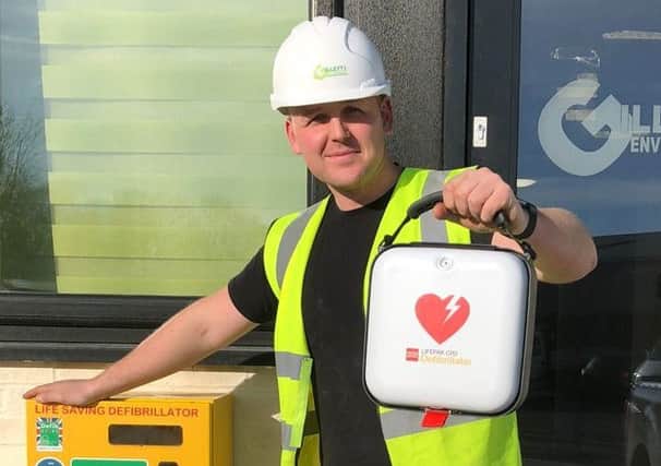 Joe Gillett of Lytham St Annes Skip Hire with a defibrillator the company is offering for the centre of Lytham