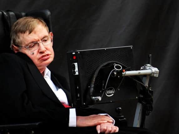 Professor Stephen Hawking, who has died aged 76, during the unveiling of The Corpus Clock