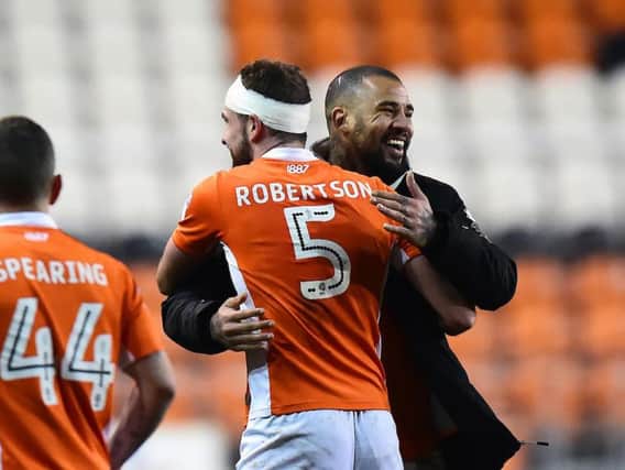 The Blackpool players celebrate at full time