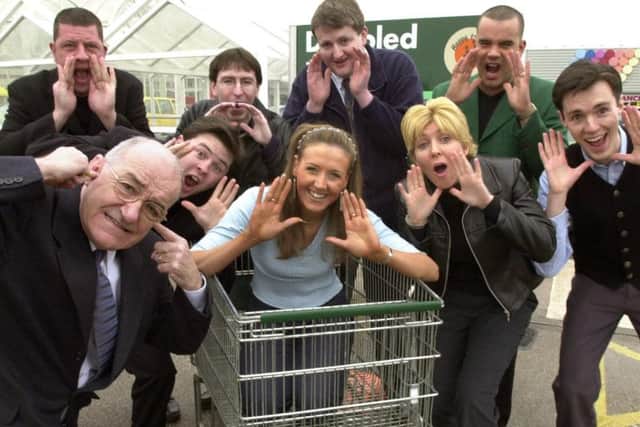 Jim Bowen, left, is overwhelmed by the 'voices' competing for the celebrity sound-a-like disabled parking space machines at the Asda store in Blackpool in 2001. Left to right: Stuart Smith, Chris Rhodes, Bradley King, Lisa Cailes, Iain Riches, Kerry Wilson, Leslie Gibson (winner), Simon Whitehouse.