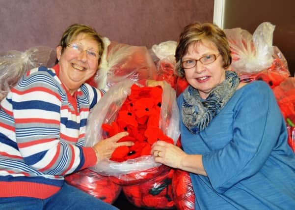 Tutors Ginette Ward and Debra Smith with the donated poppies
#TheGreatBTHKnit, launched last year, aims to receive handmade poppies for a unique art installation to mark the World War 1 Centenary.