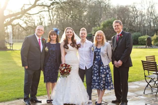 Roz and Leanne Edwards with family on their wedding day.