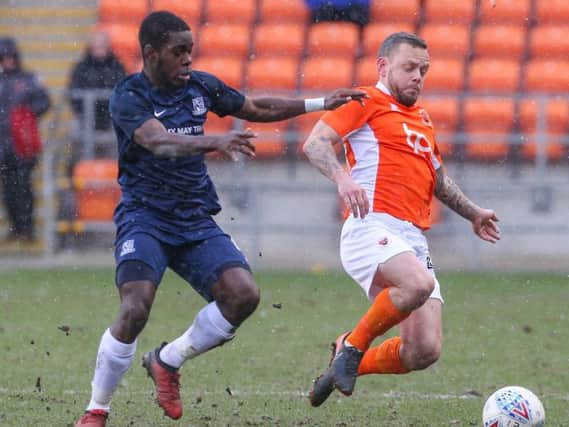 Blackpool's Jay Spearing makes another crunching tackle