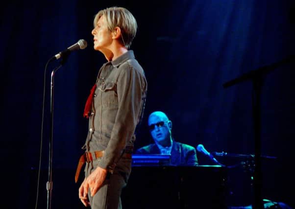 Mike Garson (at keyboards) on stage with David Bowie