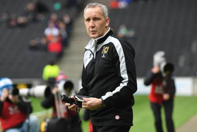 Millen is now assistant manager at MK Dons