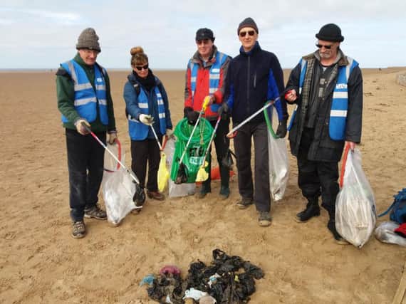Beach clean volunteers wiht some of the bags of dog  mess found on St Annes beach