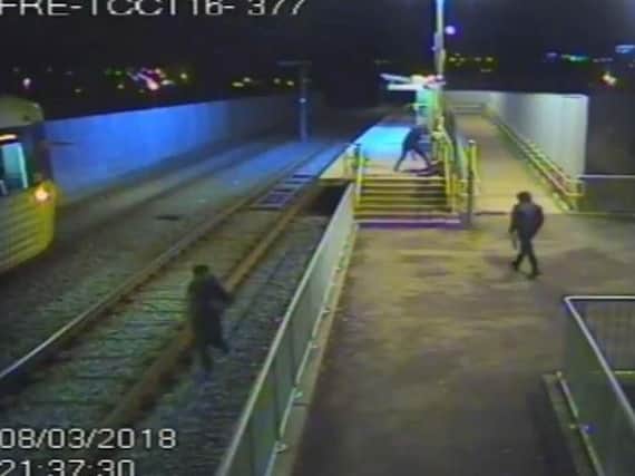 Brutal unprovoked assault on a man as he laid defenceless in a pool of blood at the Metrolink station in Chadderton, Greater, Manchester. Photo credit: GMP/PA Wire