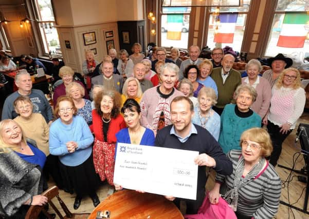 The Victoria Hotel have donated money to Just Good Friends.  Members are pictured with general manager Annamarie Pearson and area manager Ben Hardwick holding the cheque.