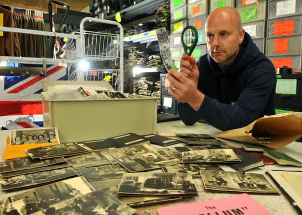 Photo Neil Cross
Scott Felton examining some of the memorabilia and personal effects belonging to George Formby found in an office clearance