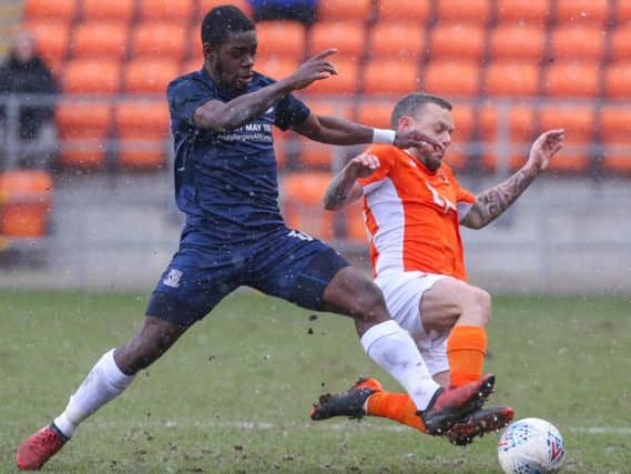 Jay Spearing challenges Southend's Theo Robinson