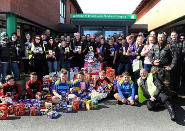 Members of the Setantii Motorcycle Club brought a mountain of Easter eggs to Brian House hospice in Bispham.
The bikers with their eggs, and youngsters from Bispham Rugby Club who also brought eggs.  PIC BY ROB LOCK
25-3-2018