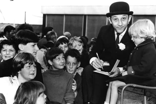 Comedian Freddie Davies, signs autographs after opening Fleetwood Bailey School garden party, in July 1968