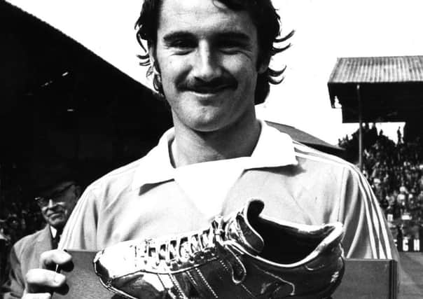 Walsh proudly holds aloft his award for the 1974-75 goal of the season