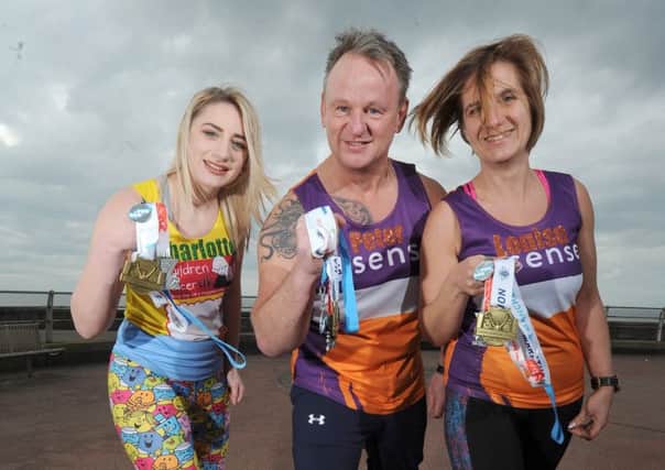 Three family members are taking part in the London Marathon.  Pictured are Peter Mowbray, daughter Charlotte Mowbray and Louise Mowbray.