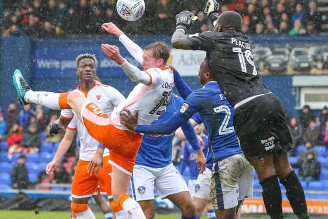 The game was played in torrential rain at Boundary Park