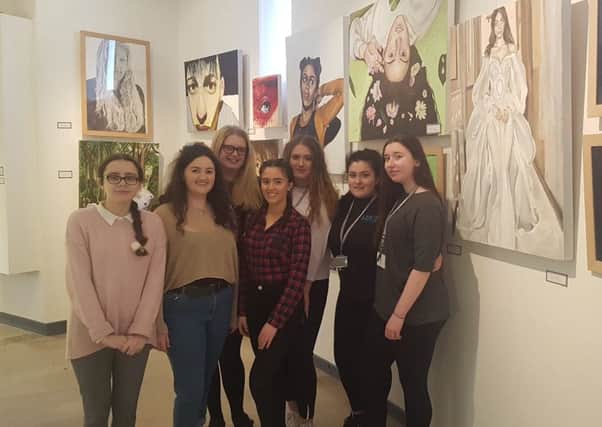 Students from Lytham St Annes Technology and Performing Arts College with their work at the Drawn From Youth exhibition at the Fylde Gallery in Lytham