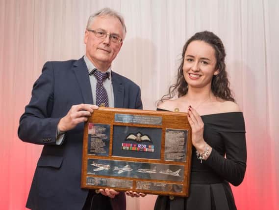 Sophie Harker receives the Bee Beamont award from Ian Muldowney