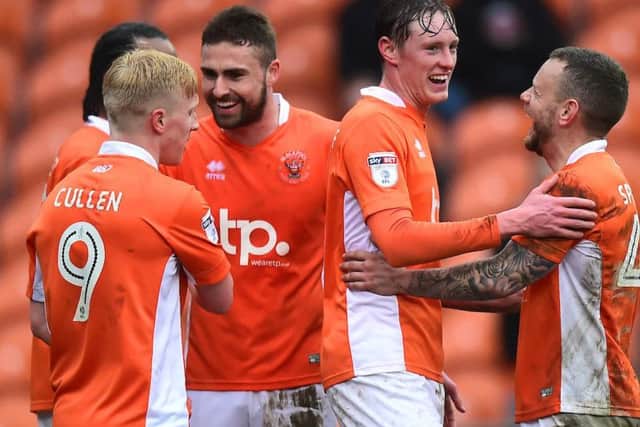 Sean Longstaff celebrates his goal - and Blackpool's fifth