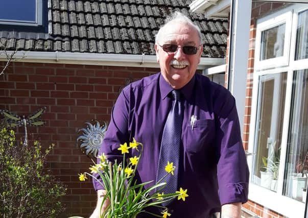 Tony Ford of St Annes In Bloom with a golf bag complete with flowers