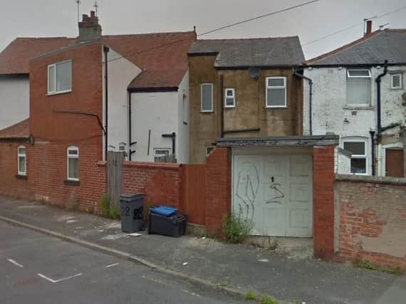 The garage torched earlier today (Picture: Google)