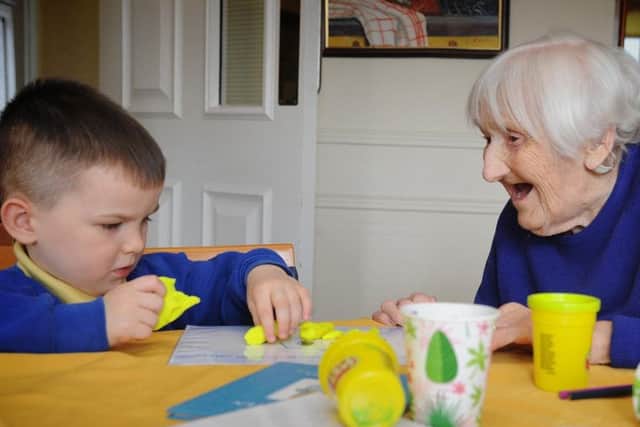 Reuben Harvey and Edna Franks having fun with Play Doh