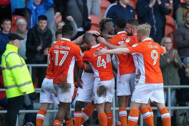 The Blackpool players celebrate their dramatic late winner