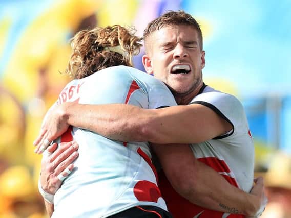 Dan Bibby (left) celebrates England's medal with team-mate Tom Mitchell