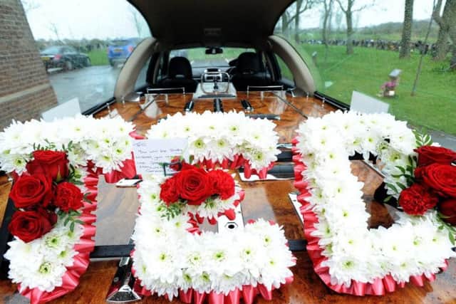 A floral memorial in honour of Ted Lowery