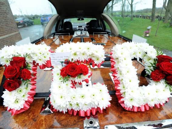 A floral memorial in honour of Ted Lowery