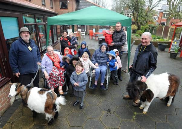 Animals from Farmer Parrs drop in to see residents and visitors at Glenroyd Nursing Home on Whitegate Drive.  Residents and children from Meadow Kindergarten with some of the animals and staff from Farmer Parrs.