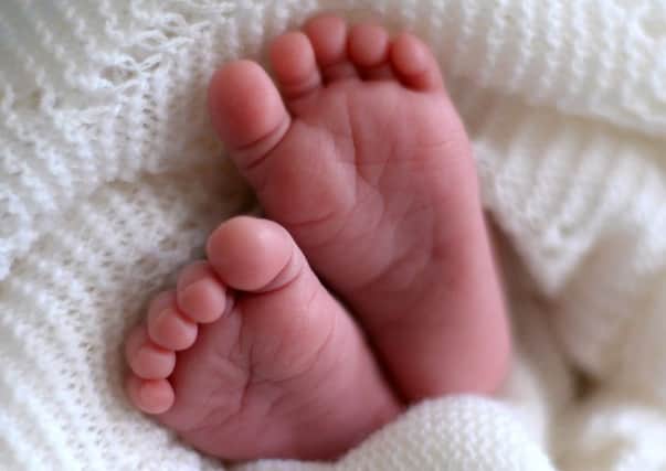 A newborn baby's feet.