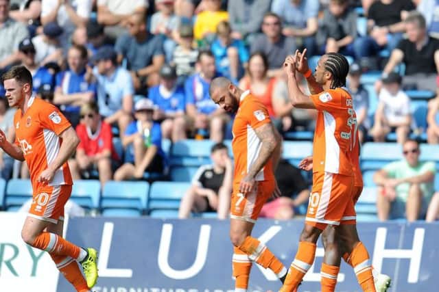 Nathan Delfouneso celebrates after doubling Blackpool's lead