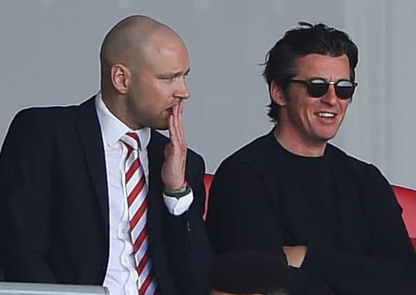 Joey Barton watches on during Towns defeat to Wigan Athletic