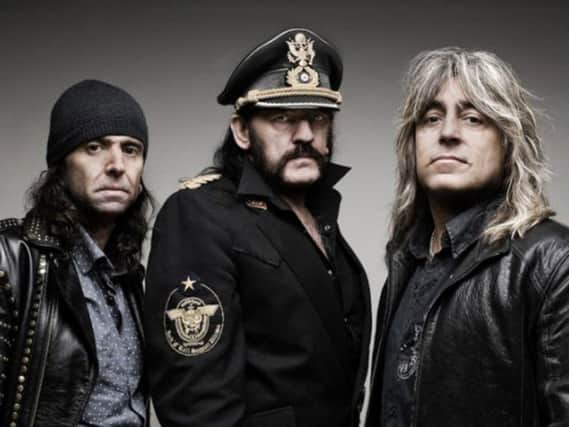 Phil Campbell (left) and Mikkey Dee (right) with late Motorhead bassist and frontman Ian 'Lemmy' Kilmister