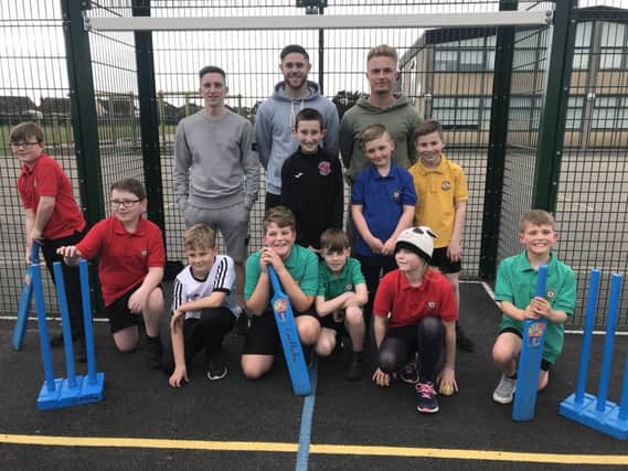 Ash Hunter, Wes Burns and Kyle Dempsey took part in a cricket session at Larkholme Primary School.