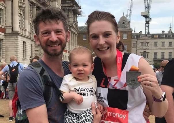 Liz Canavan after running the 2018 London Marathon with husband Steve and their daughter Mary