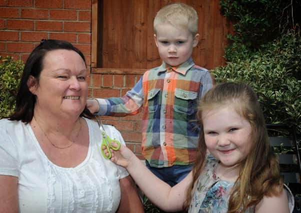 Kath Young, of Kingston Avenue South Shore, will be having her head shaved to raise funds for Cancer Research UK.
Kath has a bit of practice with grandchildren Bobby (3) and 7 year-old Amelia.  PIC BY ROB LOCK
22-4-2018