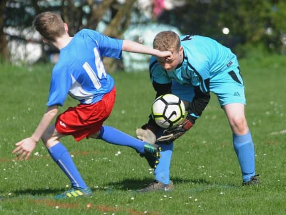 Poulton keeper Harry Fallows collects the ball   Picture: ROB LOCK
