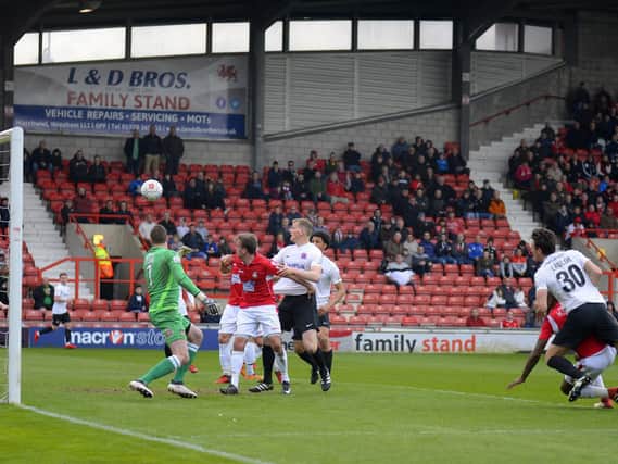 Jake Lawlor sees a header cleared off the line at Wrexham   Picture: STEVE MCLELLAN
