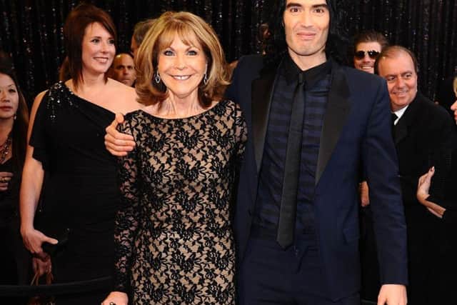 Russell Brand with mother Barbara, who remains in a critical condition after a car accident last week. The comedian has cancelled his Blackpool tour date.