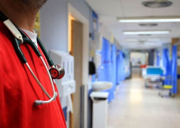 File photo dated 03/10/14 of a nurse on a ward at a hospital, as a report by Macmillan Cancer Support has suggested that specialist cancer nurses are being "run ragged", with high vacancy rates meaning patients may not be receiving the level of specialist care they need. PRESS ASSOCIATION Photo. Issue date: Monday April 30, 2018. The charity said there is a "startlingly broad variation" in the number of specialist cancer nurses in some parts of England compared to how many new patients are being diagnosed. See PA story HEALTH Nurses. Photo credit should read: Peter Byrne/PA Wire